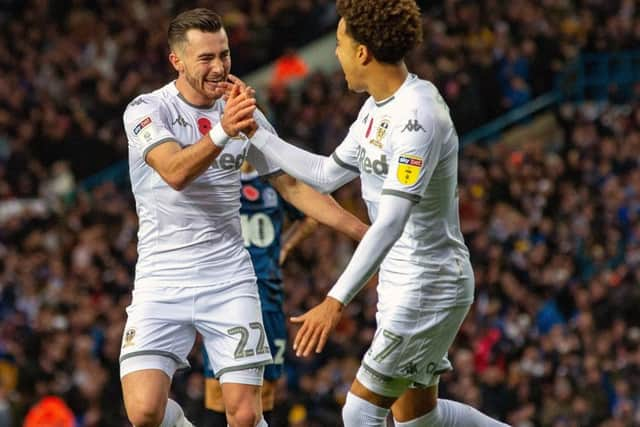 Jack Harrison celebrates scoring Leeds' second goal with Helder Costa. (Picture: Bruce Rollinson)