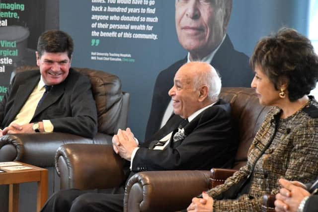 Trust Chief Executive Chris Long with Dr Assem Allam and his wife Fatima.