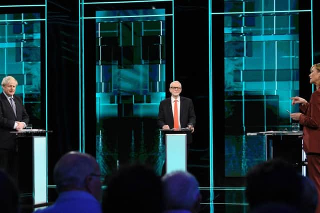 Boris Johnson, Jeremy Corbyn, and newscaster Julie Etchingham in the studio prior to tonight's election head-to-head debate on ITV. Photo: ITV/PA Wire