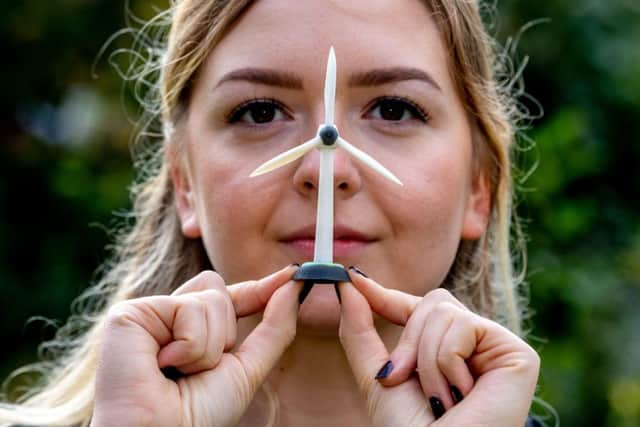 Student Hannah Clague, with a model of a wind turbine.