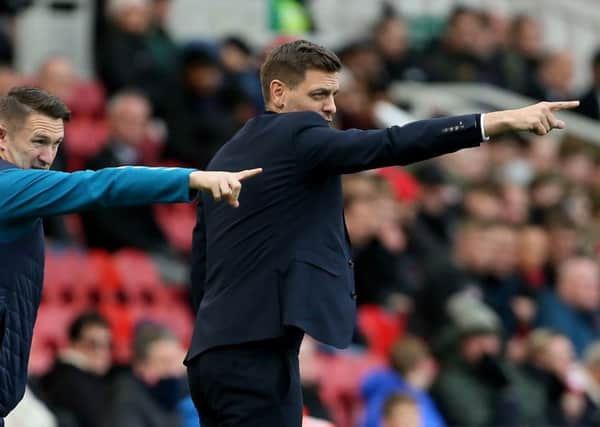 Middlesbrough assistant Robbie Keane with manager Jonathan Woodgate (right).