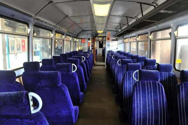 A dated Pacer interior with bus-style seating