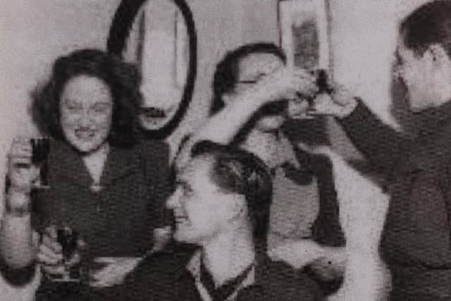 A POW enjoying Christmas at a stranger's home in England.