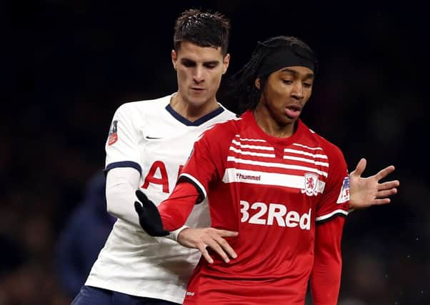 Emerging Boro talent: Tottenham Hotspur's Erik Lamela shadows Djed Spence.