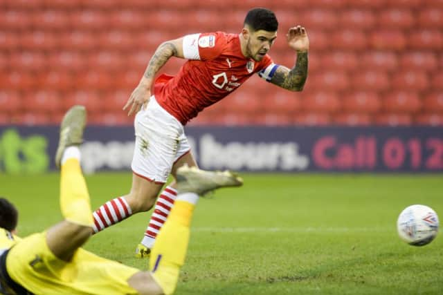 Barnsley captain Alex Mowatt in action against Huddersfield (Picture: Dean Atkins)