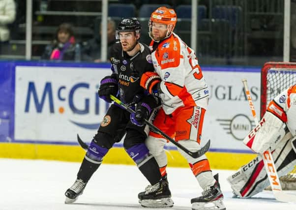 Aaron Johnson battles with Glasgow's Scott Pitt during Wednesday night's Challenge Cup semi-final, first leg clash. Picture: Al Goold/EIHL.