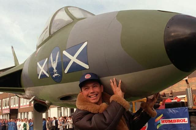 Archive pic: England Rugby Union winger and RAF fighter pilot, Rory Underwood, helping to move the Hawker Hunter jet aircraft into position outside the Humbrol factory in Hull in 2005