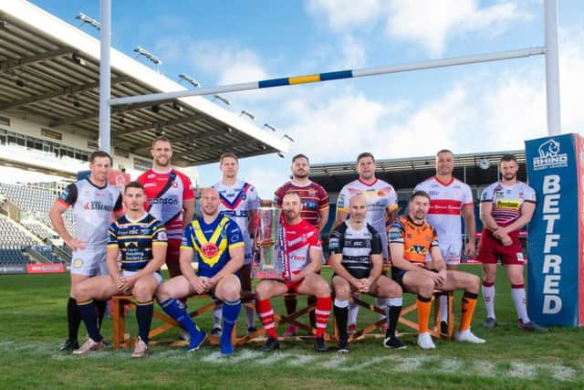 The captains of the dozen Super League clubs get together ahead of the kick-off. (PIC: Allan McKenzie/SWpix.com)