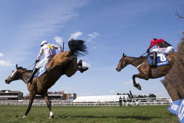 Takingrisks and Sean Quinlan clear the last in the 2019 Scottish Grand National.