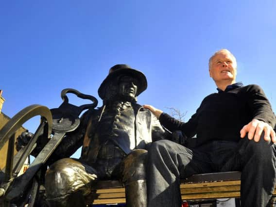 Mr Higgins with a statue of Blind Jack of Knaresborough, who Mr Kellett wrote a book about.