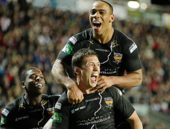 Huddersfield's Leroy Cudjoe celebrates Shaun Lunt's try with him.

 (Picture: Maurice Jones).