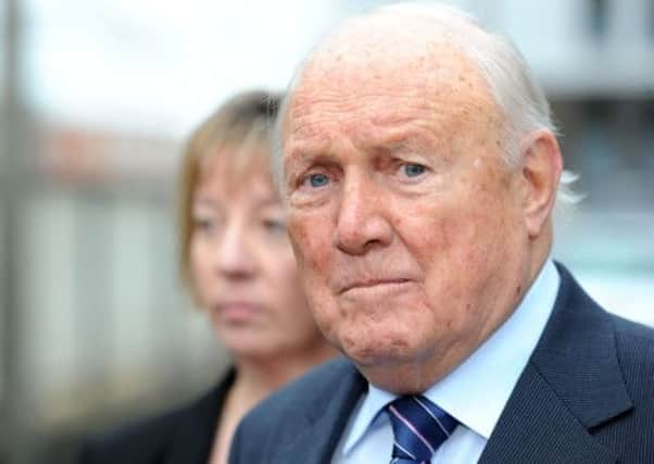 Former TV presenter Stuart Hall reads a statement outside Preston Magistrates Court.