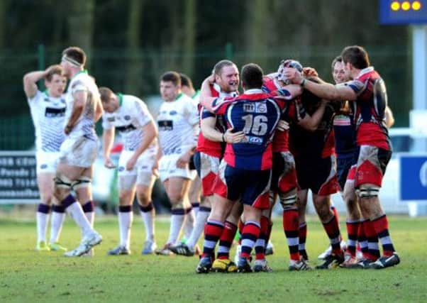 Doncaster's players celebrate their victory.