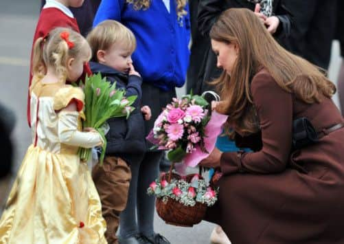 The Duchess of Cambridge meets Isobell Lauren, 3, and Oliver Axcell, 3, on a visit to the Peak Lane Fire Head Quarters in Grimsby.