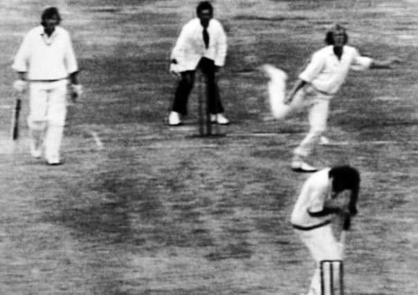 New Zealand batsman Ewan Chatfield turns after being hit by a delivery from England pace bowler Peter Lever