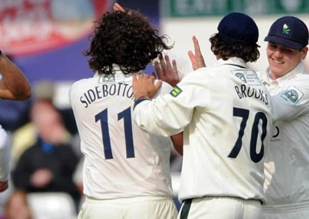 Ryan Sidebottom celebrates getting the wicket of Sussex Luke Wells