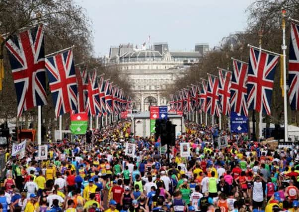 Competitors stream past the finish line