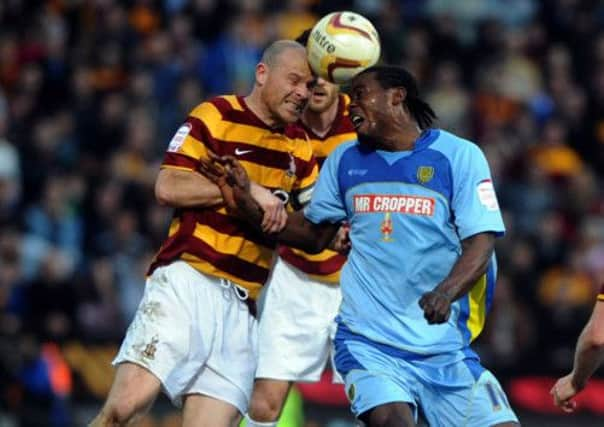 Gary Jones challenges Calvin Zola.