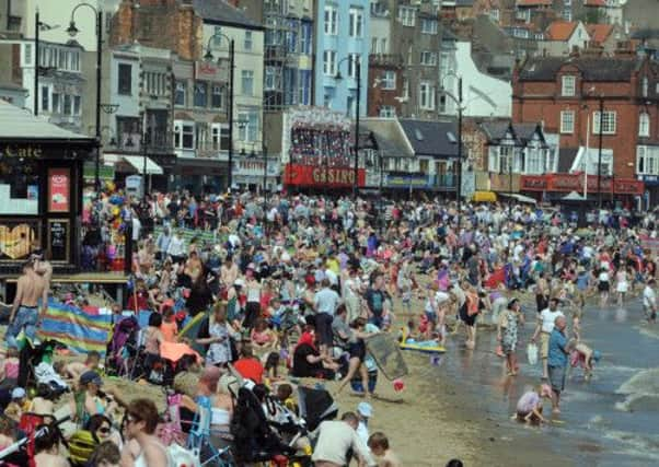 A packed South Bay beach at Scarborough as temperatures soar on Bank Holiday Monday. Picture by Gerard Binks