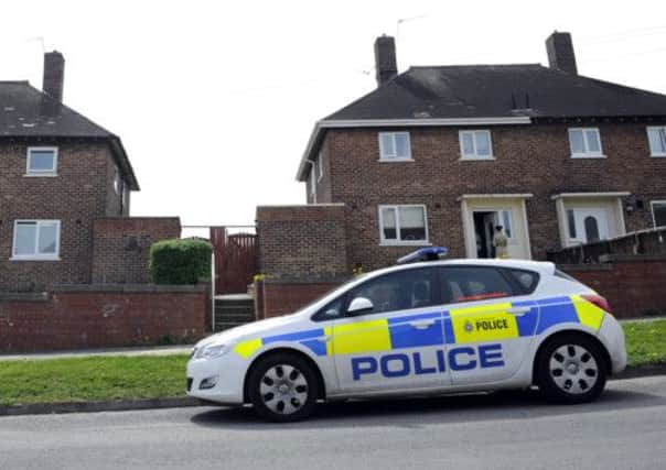 Police outside the house on Handsworth Grange Road, Sheffield