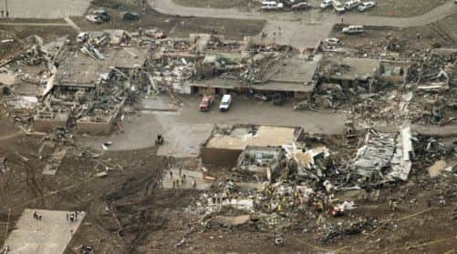 A tornado roared through the Oklahoma City suburbs Monday, flattening entire neighborhoods