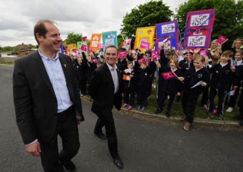 A warm welcome from the children of Kippax School near Leeds as the Tour de France Director Christian Pruhomme (left) and Tour legend Bernard Hinault