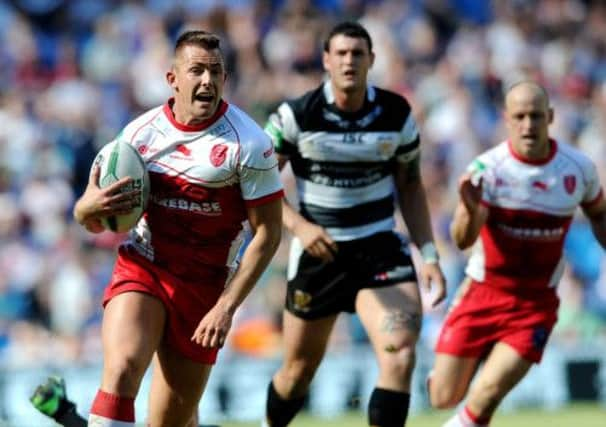 Hull KR's Greg Eden gets away to score his try.