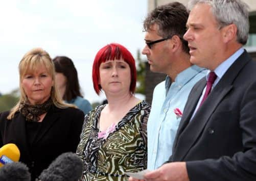 Coral (second left) and Paul Jones (second right), the parents of April Jones listen to Ed Beltrami, Chief Crown Prosecutor for CPS Wales