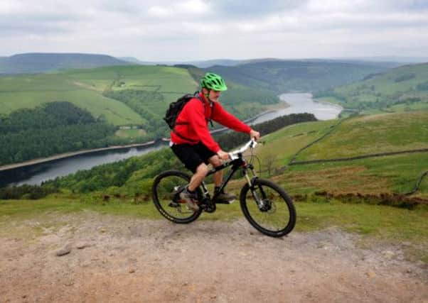 Pennine Way ranger Martin Sharp at the top of Winstone Lee Tor overlooking Ladybower Reservoir. Picture: Scott Merrylees