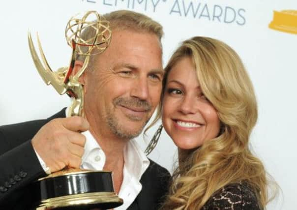 Actor Kevin Costner with his wife Christine Baumgartner