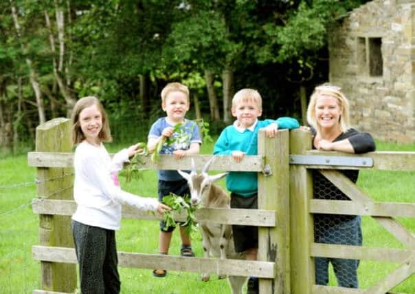 Cheryl Fewster with her children and Malcolm Fewster, below.