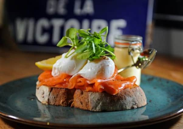 Eggs Royale with scottish smoked slamon with a watercress salad served on toasted granary bread