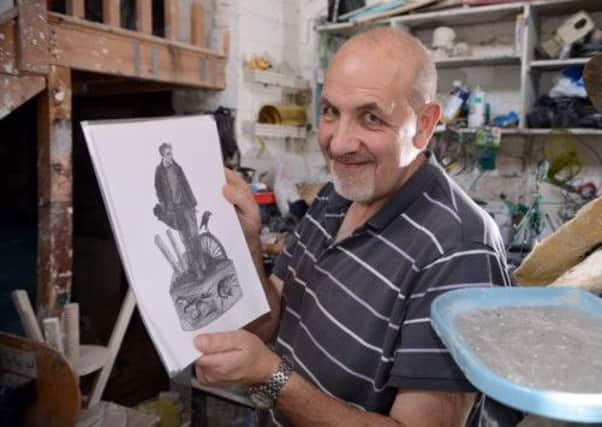 Barnsley sculptor Graham Ibbeson with with his sketch of the proposed Ted Hughes sculpture for Mexborough