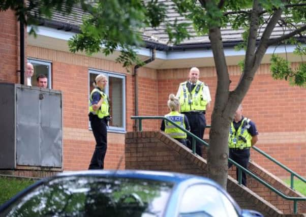 Police at the Bangladeshi Centre, Roundhay Road, Harehills Leeds, this morning.