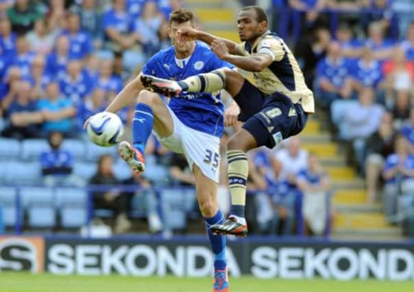 Rodolph Austin beats David Nugent to the ball.