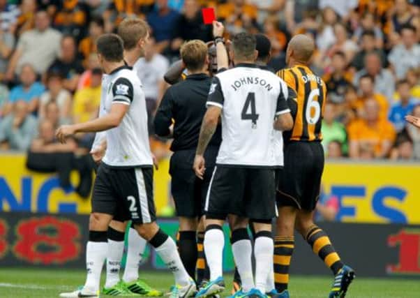 Hull City Tigers Yannick Sagbo is shown a red card during the Barclays Premier League match at the KC Stadium. (Picture: Richard Sellers/PA Wire).