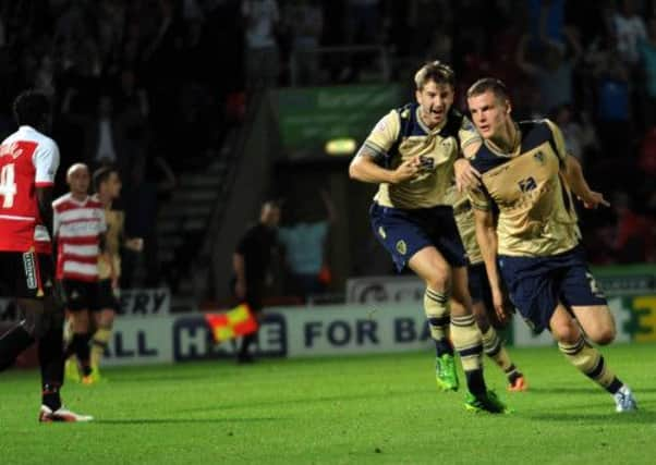 ON TARGET: Leeds United's Matt Smith wheels away to celebrate scoring his side's second goal against Doncaster Rovers at the Keepmoat Stadium last night. PICTURE: Jonathan Gawthorpe.