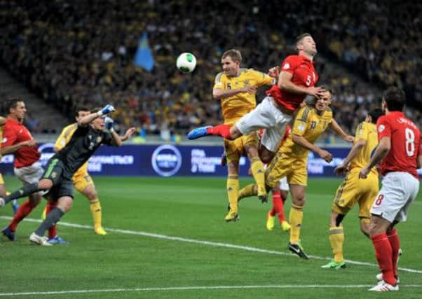 England's Gary Cahill (right) and Ukraine's Olexandr Kucher battle for the ball