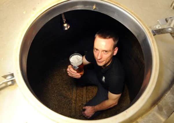 Head brewer Alex Dodds with a pint of Three Swords at Kirkstall Brewery, Leeds