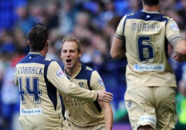 Luke Varney is mobbed after scoring the winning goal.