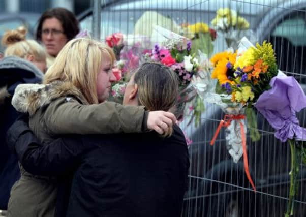 Family and friends at the scene of the scene of the crash on Thornton Road in Bradford. Picture: Ross Parry Agency