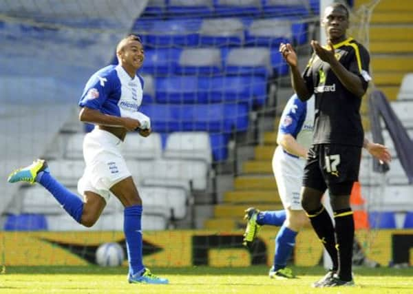 City's four goal Jesse Lingard celebrates much to the disgust of Owls Jeremy Helan.