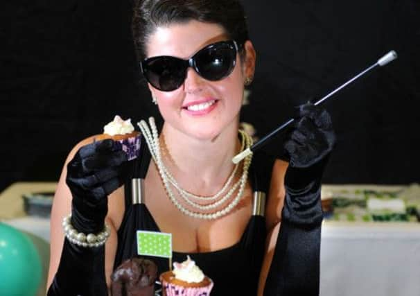 Staff member Tyrell Jones as Audrey Hepburn, at the Macmillan Coffee Morning