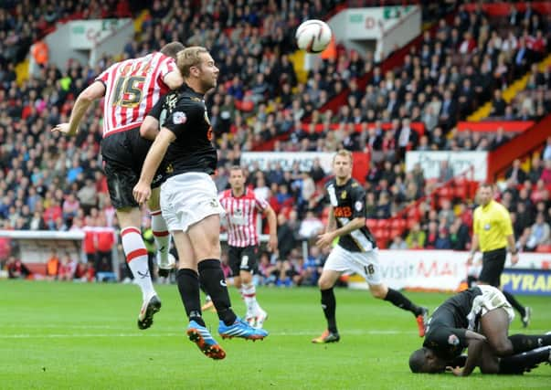 Neill Collins heads in the Blades opening goal.