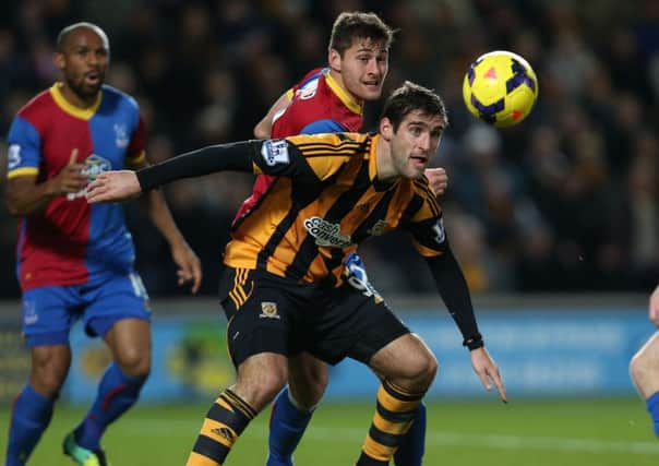 Hull City's Danny Graham and Crystal Palace's Joel Ward battle for the ball