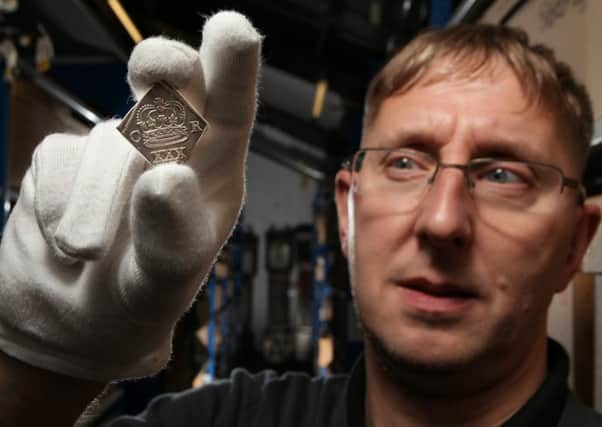 Civil War museum curator Glynn Hughes with a siege piece - a silver coin minted in Newark during the deadly 3rd siege (1645-46) when the town was cut off by Parliament and its allies.