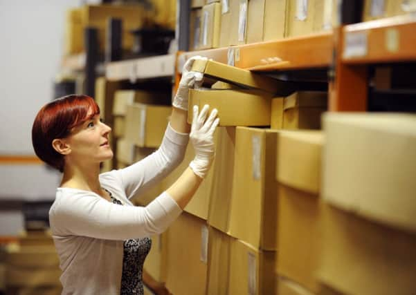 Katie Brown, Assistant Curator of History for York Museums Trust,  in the Caslte Museum stores in York