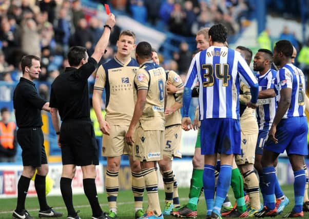 Lee Probert show's Matt Smith the red card.