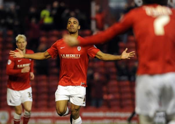 Chris O'Grady celebrates after scoring his second goal.