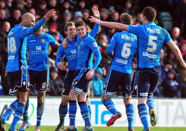 Stephen Warnock celebrates his goal with teammates. Picture: Tony Johnson